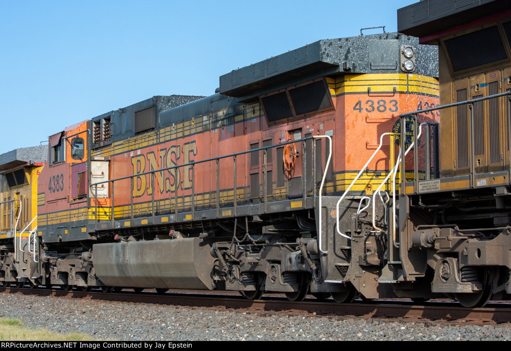 BNSF 4383 trails on a westbound rock train